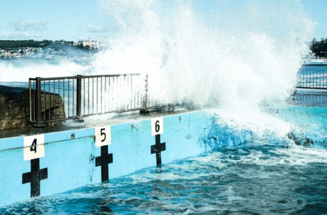 a large wave crashing into a wall