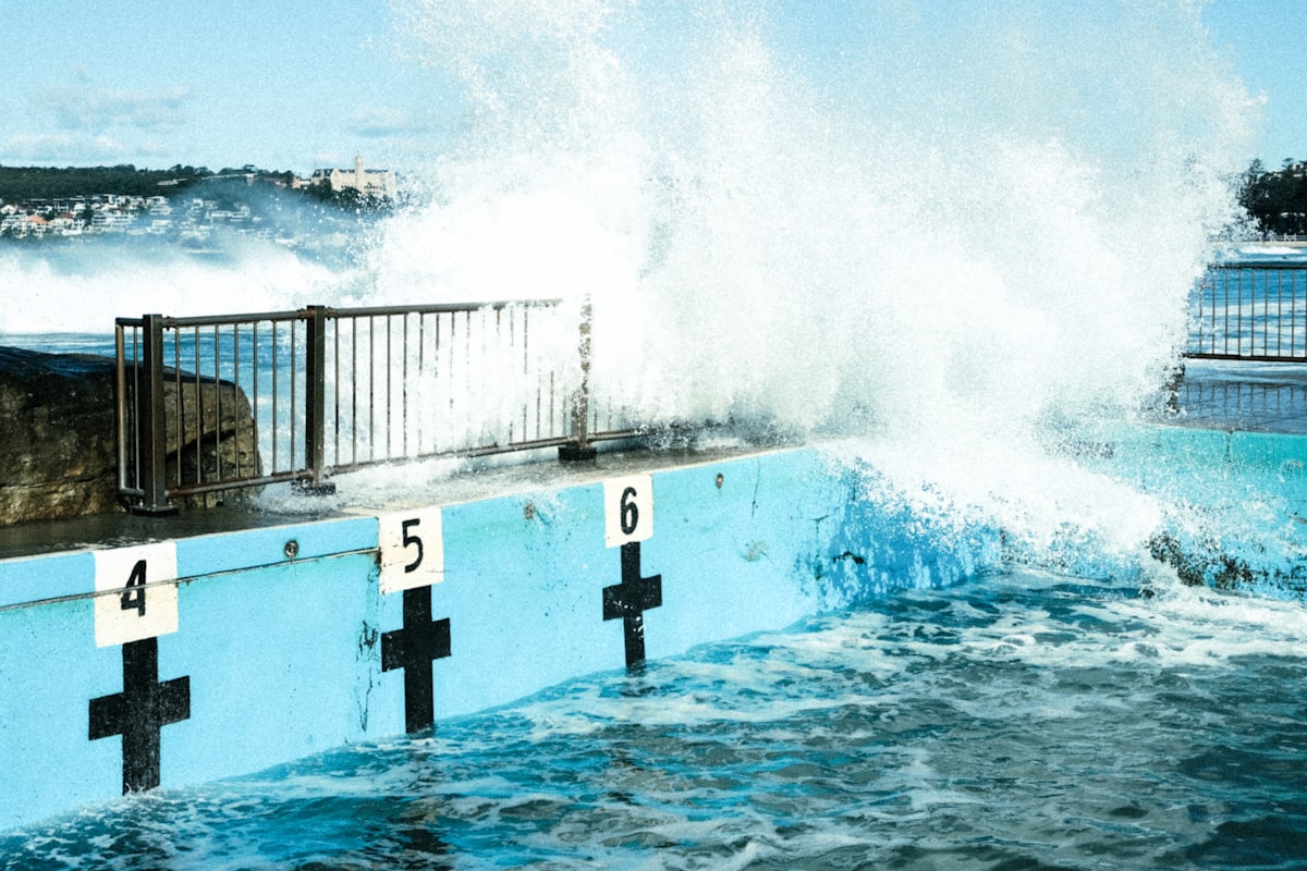 a large wave crashing into a wall