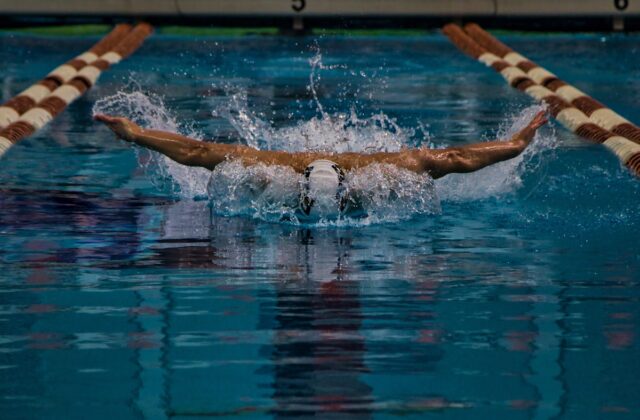 Child hesitant at a swimming pool — Singapore swimming lessons
